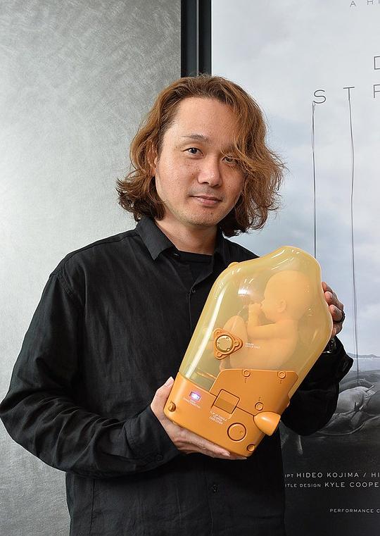 新川洋司