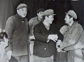 李默然