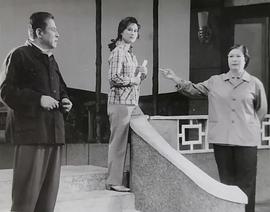 李默然